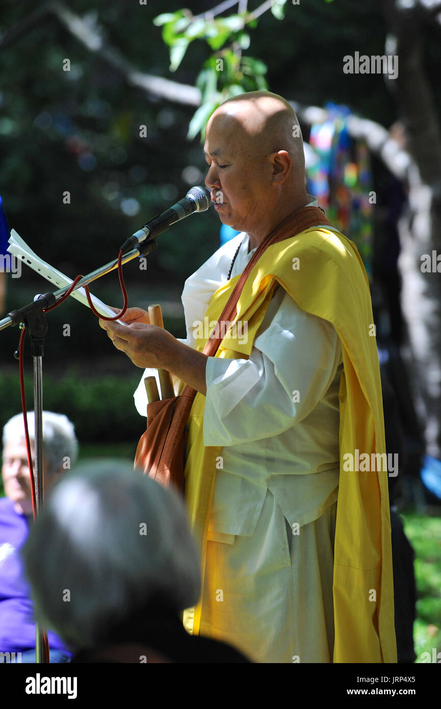 London, UK. 06th Aug, 2017. The Reverend Gyoro Nagase (a Japanese Buddhist monk) speaking at the Campaign for Nuclear Disarmament’s annual commemoration of the atomic bombing of Hiroshima, Japan in Tavistock Square, London, United Kingdom.  On 6 August 1967 a cherry tree was planted in the square by Camden Council in memory of the victims of the bombing. Since then an annual ceremony has been held around the tree to remember the attack.  The attack took place at 8.15am, 6 August 1945, when the Enola Gay Boeing B-29 Superfortress bomber dropped the ‘Little Boy’ atomic bomb, the first use of the Stock Photo