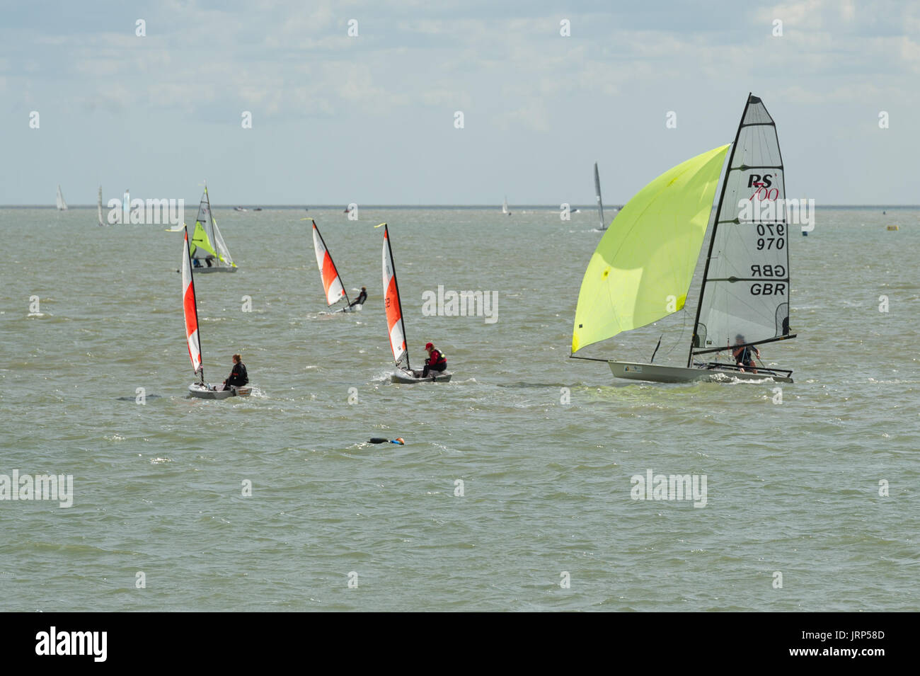 Brightlingsea, Essex, UK, 6 August 2017  Dinghy sailors competing in Pyefleet Week racing at Brightlingsea Sailing Club on the Colne Estuary in Essex. Pyefleet Week, whose main sponsor for a second year is  Learning & Skills Solutions, is one of the UK’s premier dinghy and day boat regattas and is the largest of its type on the East Coast, with up to 150 entries annually. Credit: Gary Eason/Alamy Live News Stock Photo