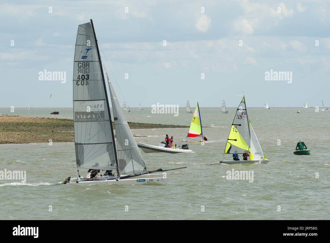 Brightlingsea, Essex, UK, 6 August 2017  Dinghy sailors competing in Pyefleet Week racing at Brightlingsea Sailing Club on the Colne Estuary in Essex. Pyefleet Week, whose main sponsor for a second year is  Learning & Skills Solutions, is one of the UK’s premier dinghy and day boat regattas and is the largest of its type on the East Coast, with up to 150 entries annually. Credit: Gary Eason/Alamy Live News Stock Photo