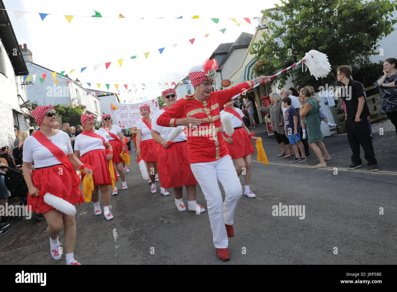 Stoke Gabriel, Devon. 5th August 2017. Stoke Gabriel's quirky yearly carnival procession makes its way through the village high street. Floats from various community groups including Stoke Gabriel Primary school and Woman's Institute (WI), showcased various themes including Harry Potter, hippies, Town Criers and Swan Lake. Stock Photo