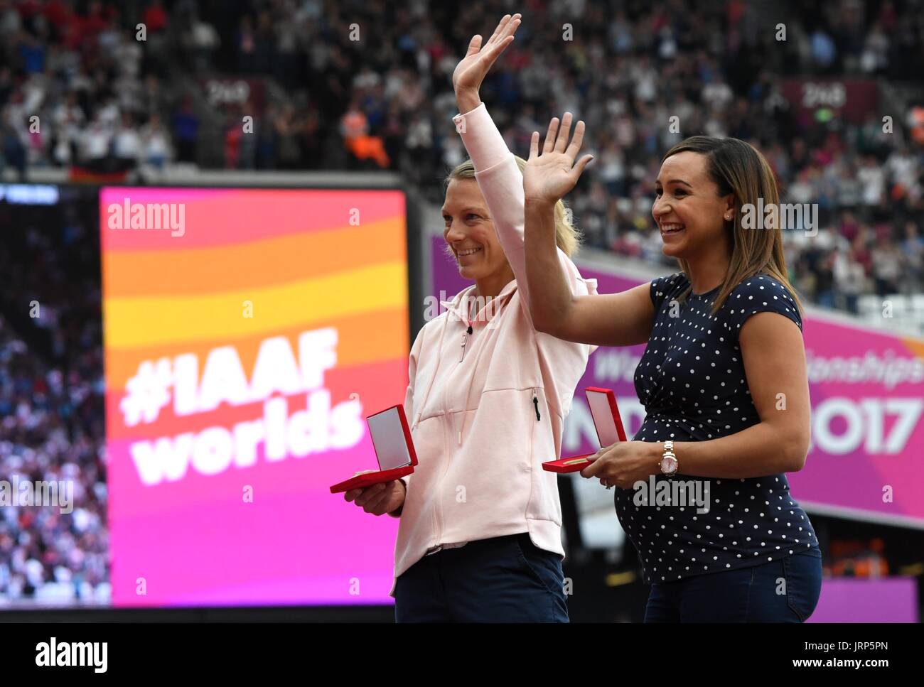 London, UK. 6th Aug, 2017. Former heptathlete Jennifer Oeser (L) of Germany belatedly receives her silver medal in the heptathlon of 2011 at the IAAF World Championships at the Olympic Stadium in Athletics in London, UK, 6 August 2017. Britain's Jessica Ennis (r) was named world champion. Oeser moved from third to second place after then-champion Tatyana Chernova of Russia was disqualified for doping. Photo: Bernd Thissen/dpa/Alamy Live News Stock Photo