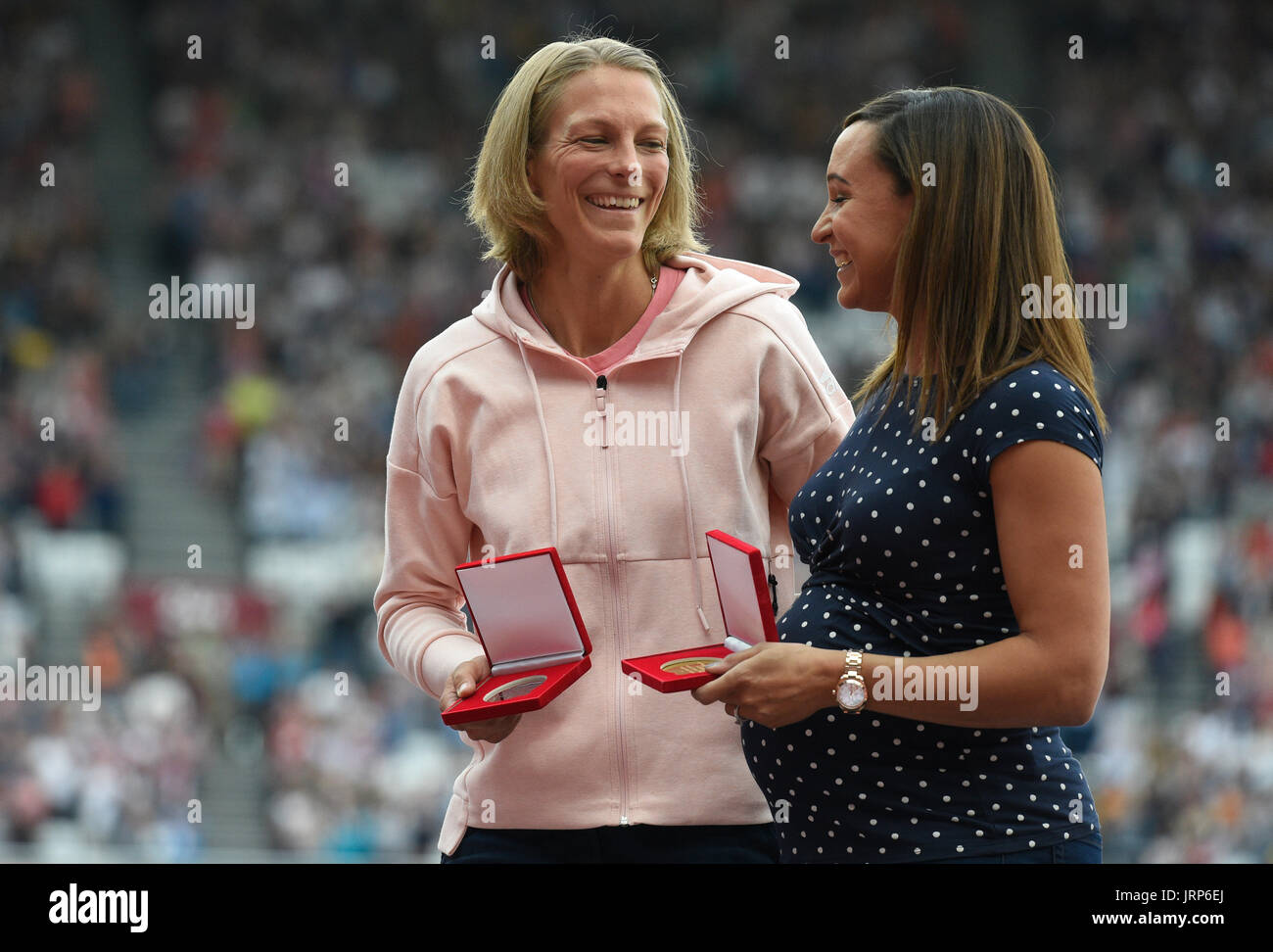 London, UK. 6th Aug, 2017. Former heptathlete Jennifer Oeser (L) of Germany belatedly receives her silver medal in the heptathlon of 2011 at the IAAF World Championships at the Olympic Stadium in Athletics in London, UK, 6 August 2017. Britain's Jessica Ennis (r) was named world champion. Oeser moved from third to second place after then-champion Tatyana Chernova of Russia was disqualified for doping. Photo: Rainer Jensen/dpa/Alamy Live News Stock Photo