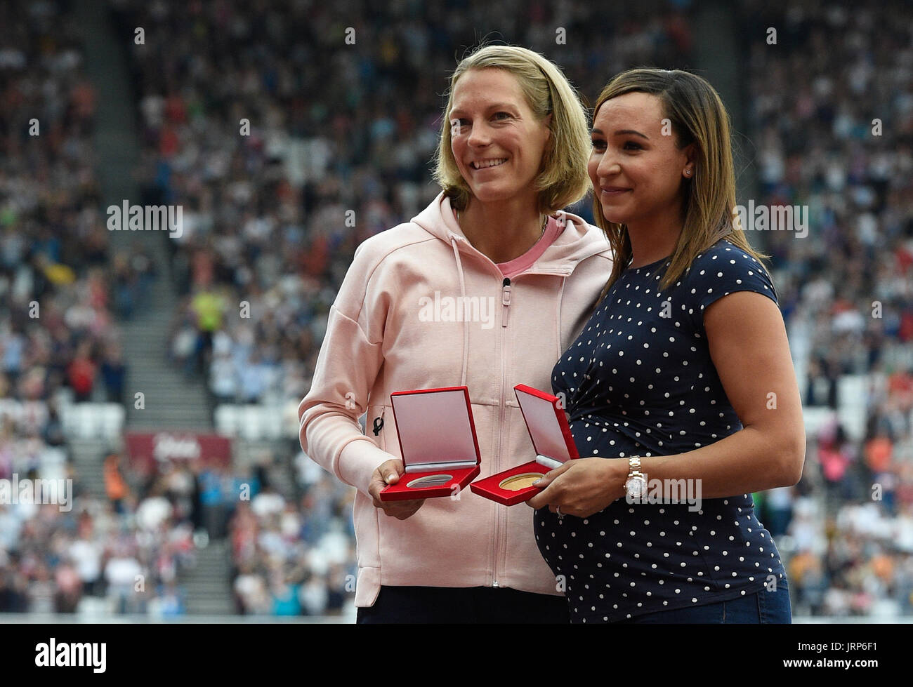 London, UK. 6th Aug, 2017. Former heptathlete Jennifer Oeser (L) of Germany belatedly receives her silver medal in the heptathlon of 2011 at the IAAF World Championships at the Olympic Stadium in Athletics in London, UK, 6 August 2017. Britain's Jessica Ennis (r) was named world champion. Oeser moved from third to second place after then-champion Tatyana Chernova of Russia was disqualified for doping. Photo: Rainer Jensen/dpa/Alamy Live News Stock Photo