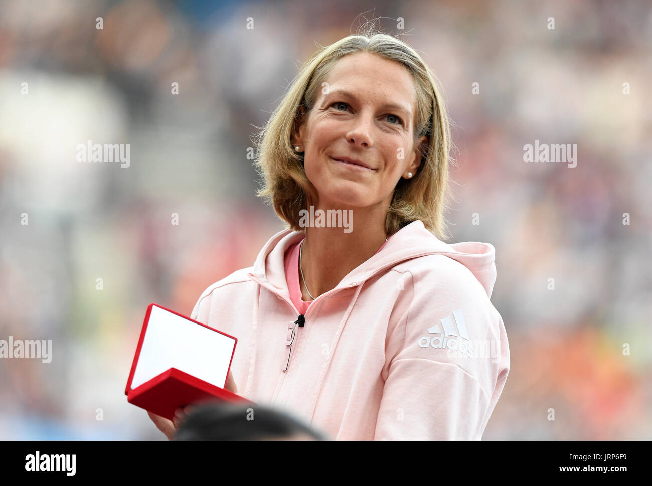 London, UK. 6th Aug, 2017. Former heptathlete Jennifer Oeser of Germany belatedly receives her silver medal in the heptathlon of 2011 at the IAAF World Championships at the Olympic Stadium in Athletics in London, UK, 6 August 2017. Oeser moved fromthird to second place after then-champion Tatyana Chernova of Russia was disqualified for doping. Photo: Rainer Jensen/dpa/Alamy Live News Stock Photo