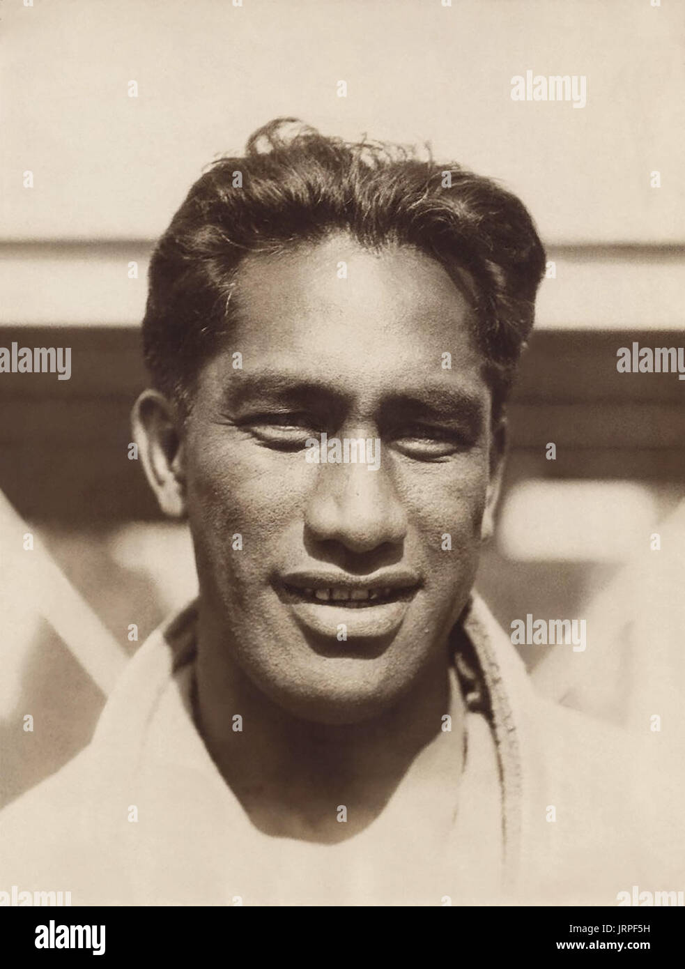 Duke Paoa Kahanamoku (1890-1968), often simply referred to as "The Duke", was a lengendary native Hawaiian surfer regarded as The Father of Modern Surfing. He was also a five-time Olympic medalist in swimming who competed in the 1912, 1920, and 1924 Summer Olympics, as well as being an alternate for the U.S. water polo team at the 1932 Olympics. Kahanamoku is included in the Swimming Hall of Fame, the Surfing Hall of Fame, and the U.S. Olympic Hall of Fame. (Pictured here c1924) Stock Photo