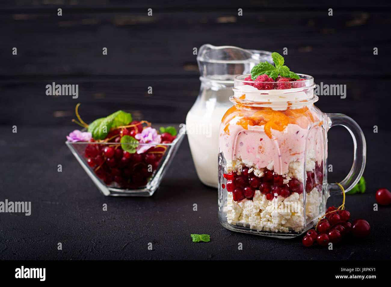 Cottage Cheese And Yoghurt Desserts With Summer Berries In A Jar