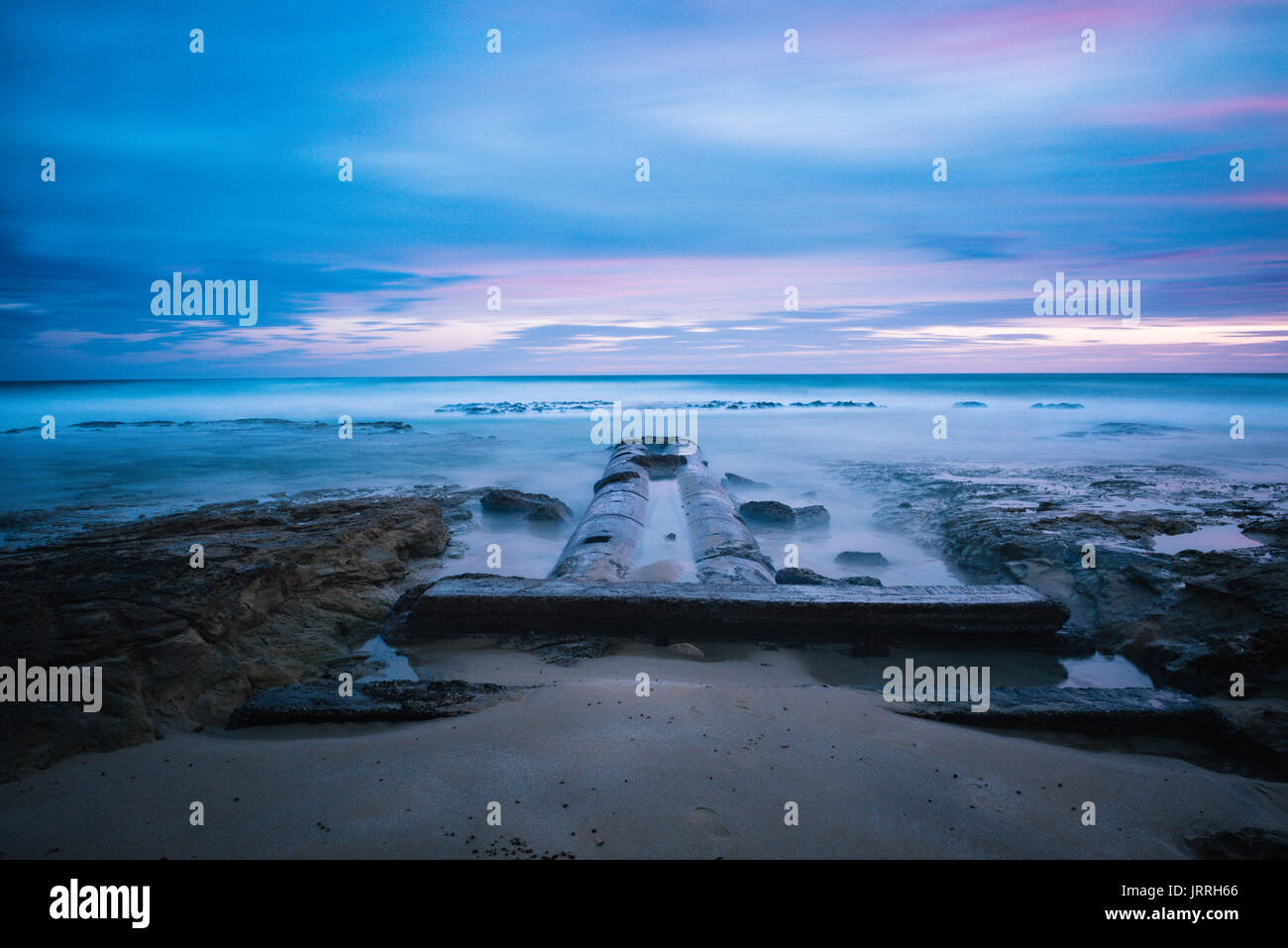 Pipes leading into the ocean at Point Roadnight, Australia Stock Photo