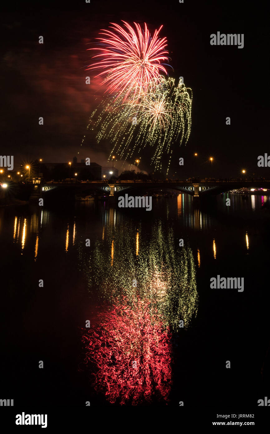 People watch the fireworks from Trent Bridge at the Nottingham Riverside Festival. Stock Photo