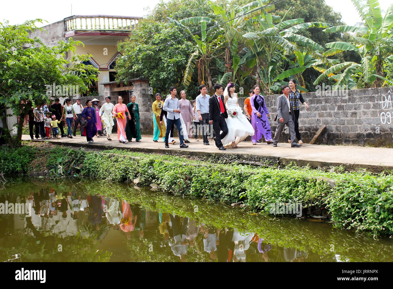 HAI DUONG, VIETNAM, July, 16: people attending the wedding tradition in rural Vietnam on July, 16,2013 in Hai Duong, Vietnam. Stock Photo