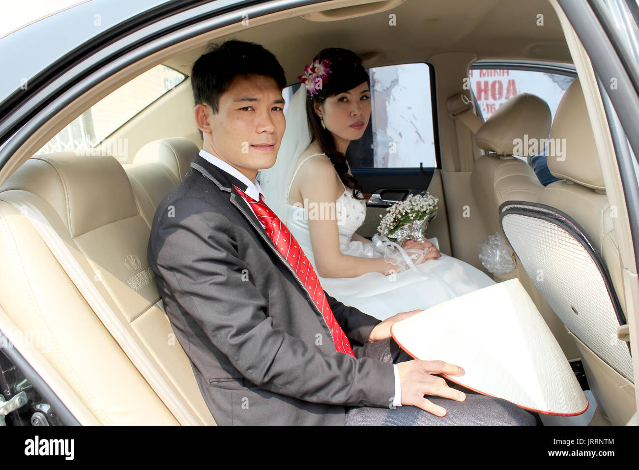 HAI DUONG, VIETNAM, July, 16: bride and groom in traditional wedding in rural Vietnam on July, 16, 2013 in Hai Duong, Vietnam. Stock Photo
