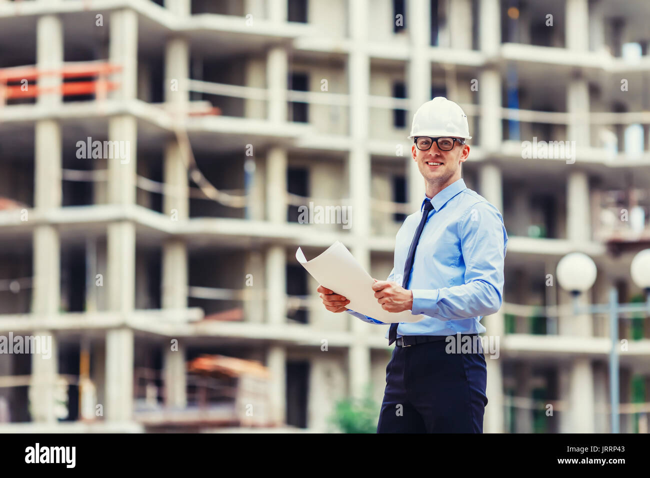 Handsom construction engineer at the construction site looking at the camera Stock Photo