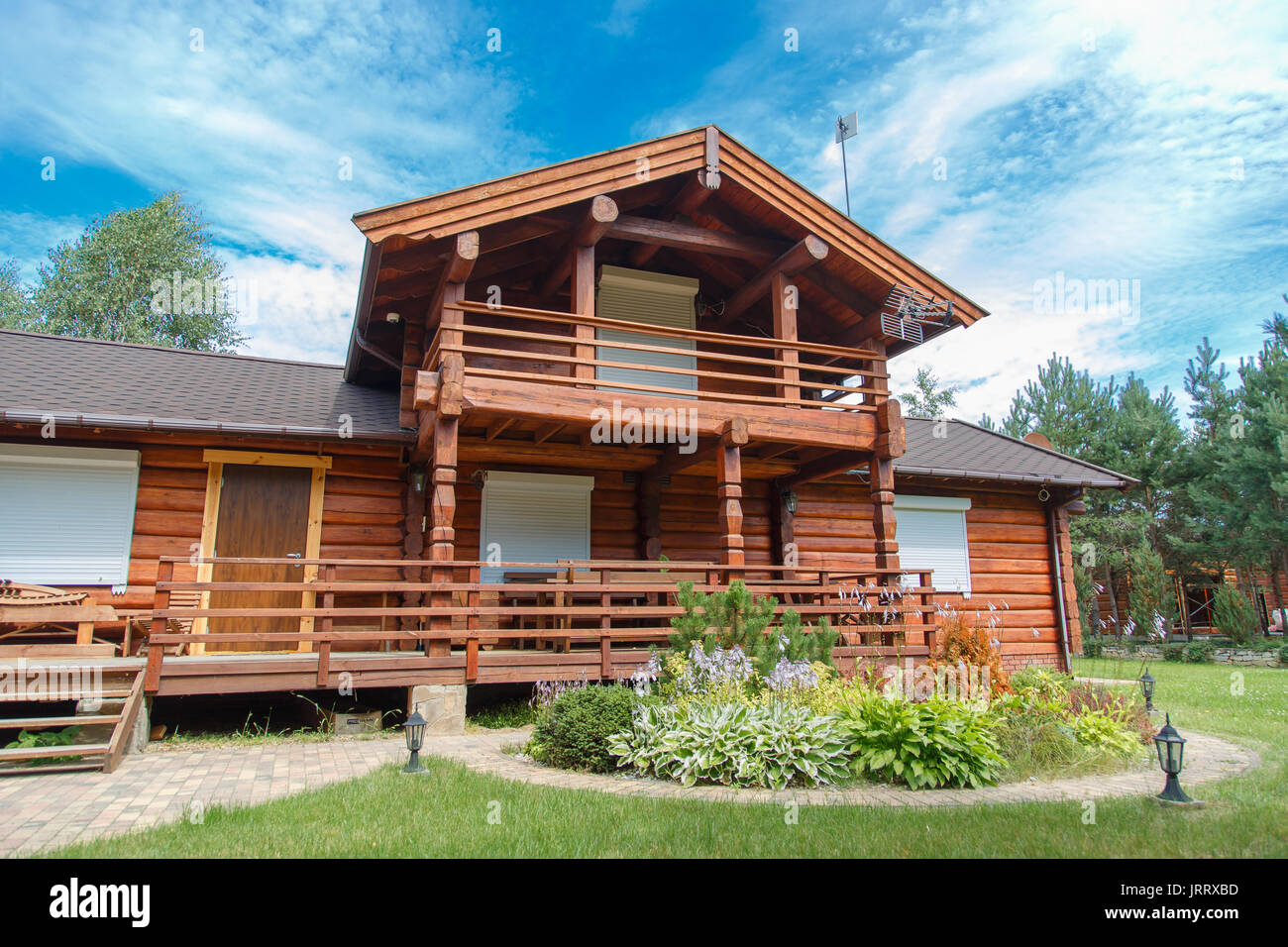 A Modern Wooden House Made Of Logs View From Outside In Summer Stock Photo Alamy
