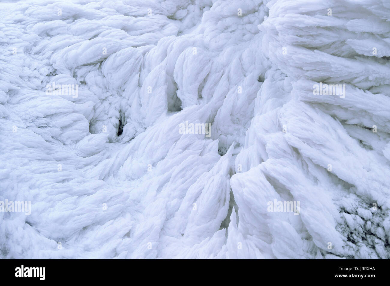 Wind painted Snow Texture Pattern on stone Background, Winter background. Stock Photo