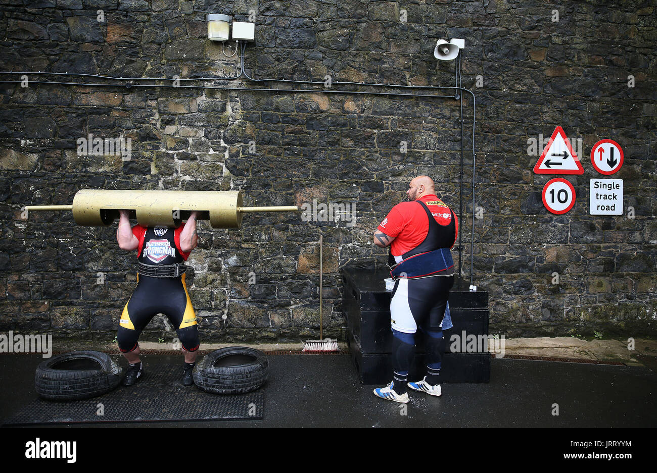 Competitors warm up during the Ultimate Strongman Masters World Championship final at Crumlin Road Gaol in Belfast. Stock Photo