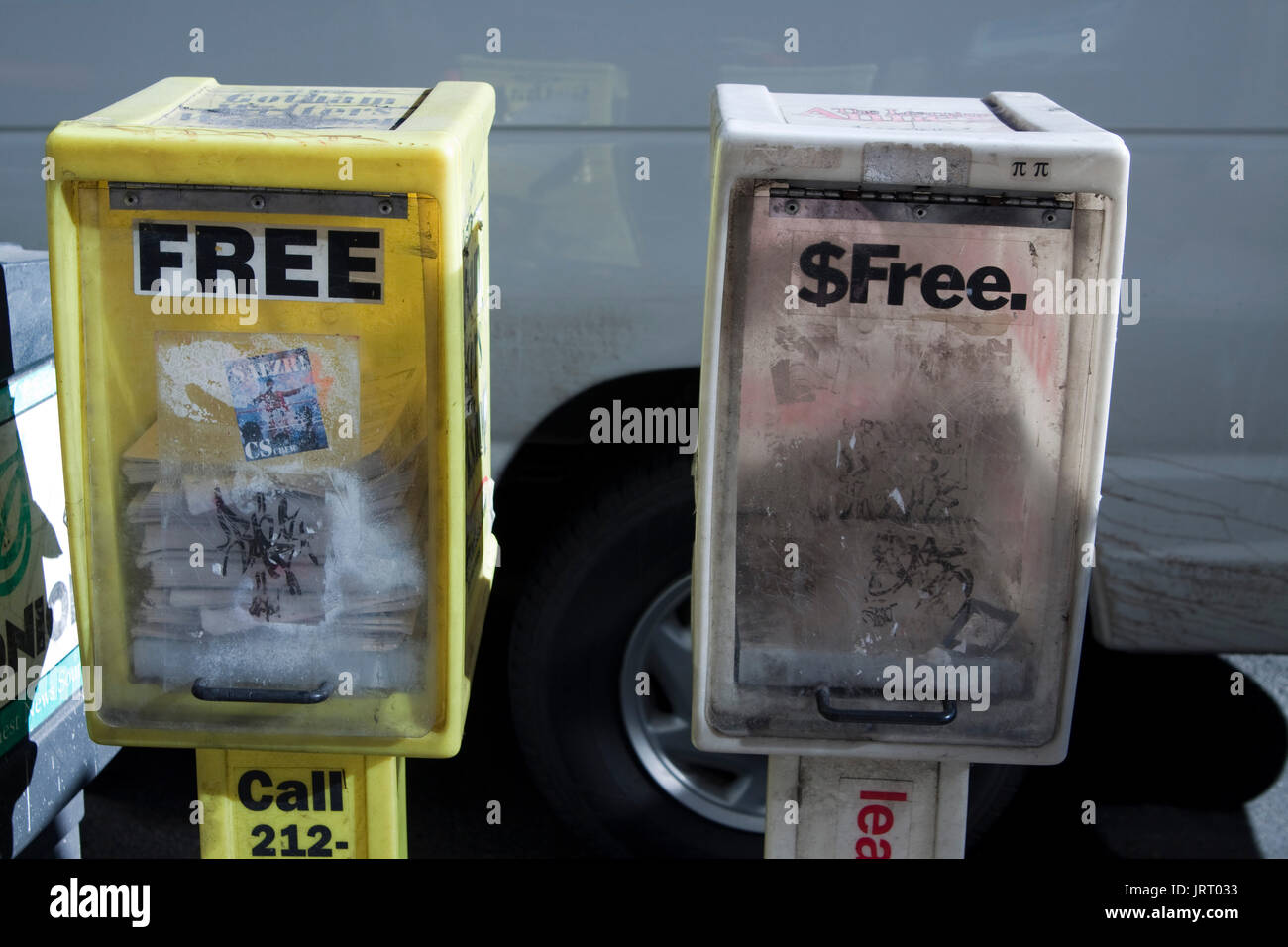 Free newspaper vending machines on street in Manhattan, NY Stock Photo