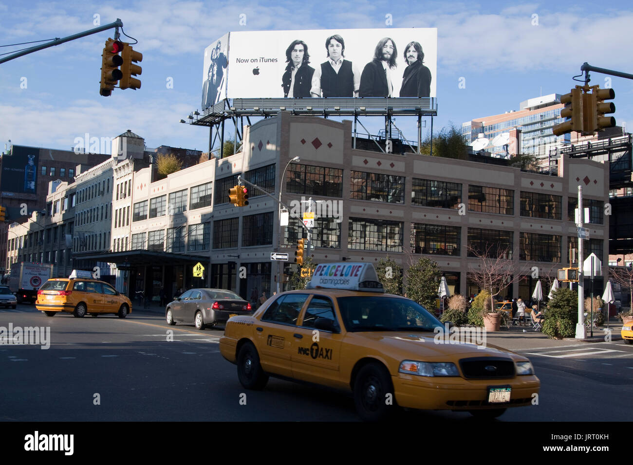 The Beatles advertisement on top of Apple Store in Manhattan, celebrating the band's catalogue being available on iTunes. Stock Photo