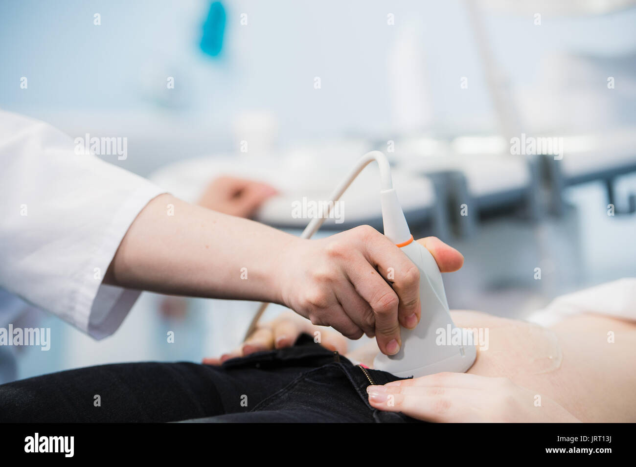 Woman receiving body ultrasound hi-res stock photography and images - Alamy