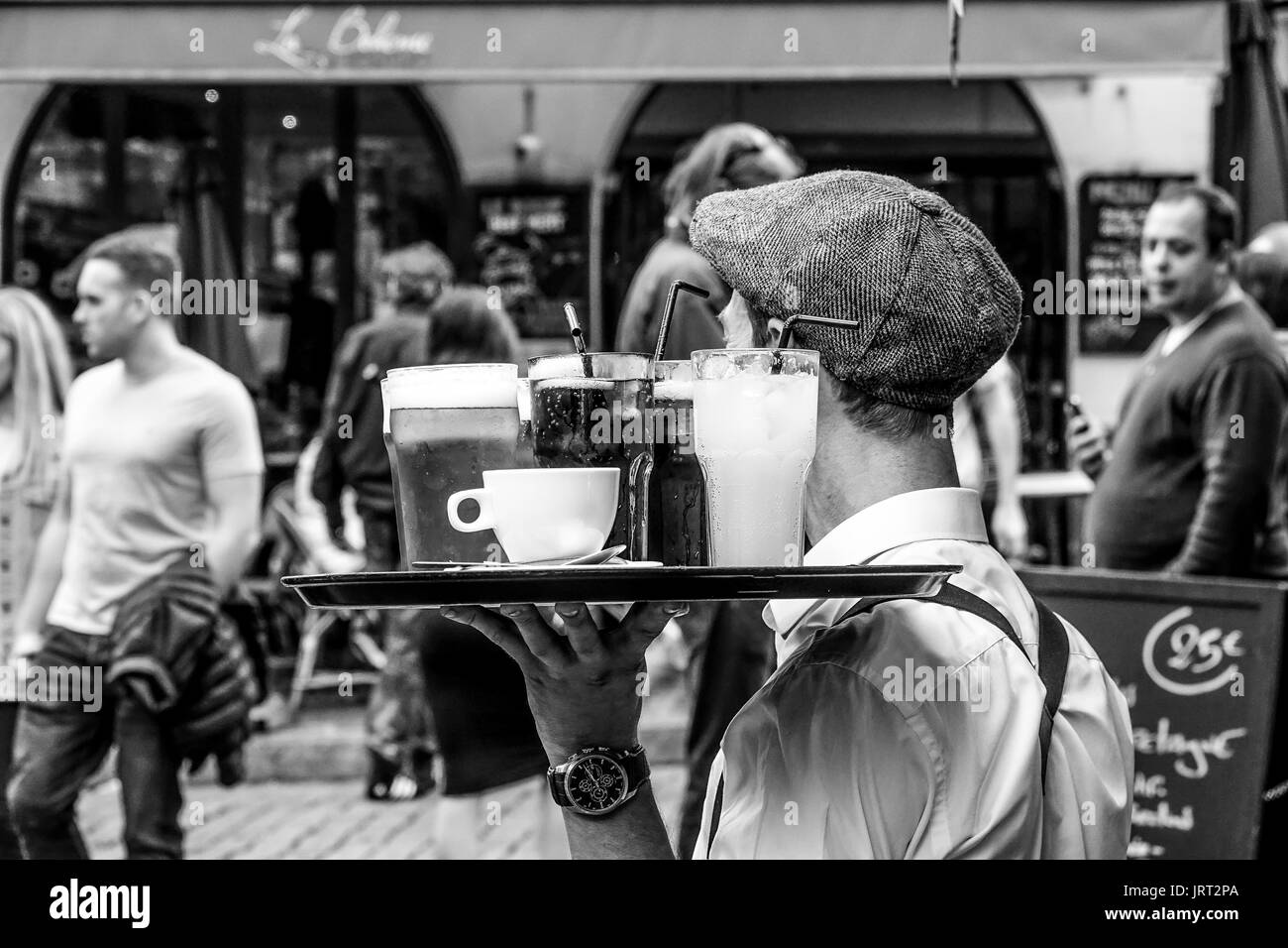 French waiter at a street cafe called garcon PARIS / FRANCE SEPTEMBER 24, 2017 Stock Photo