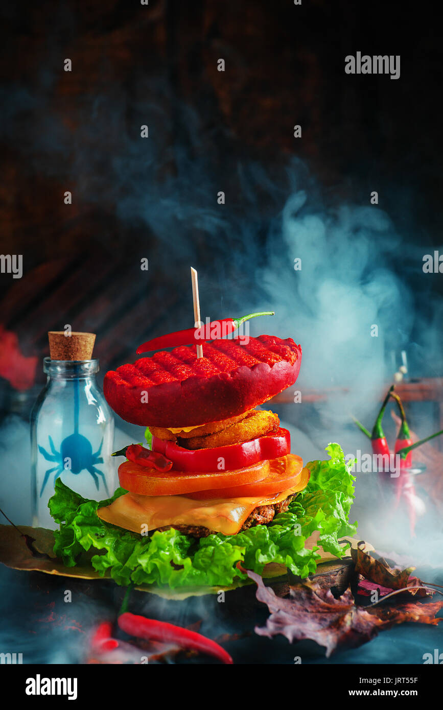 Hot Halloween Party Burger With Smoke And Scary Silhouettes In Glass Stock Photo Alamy