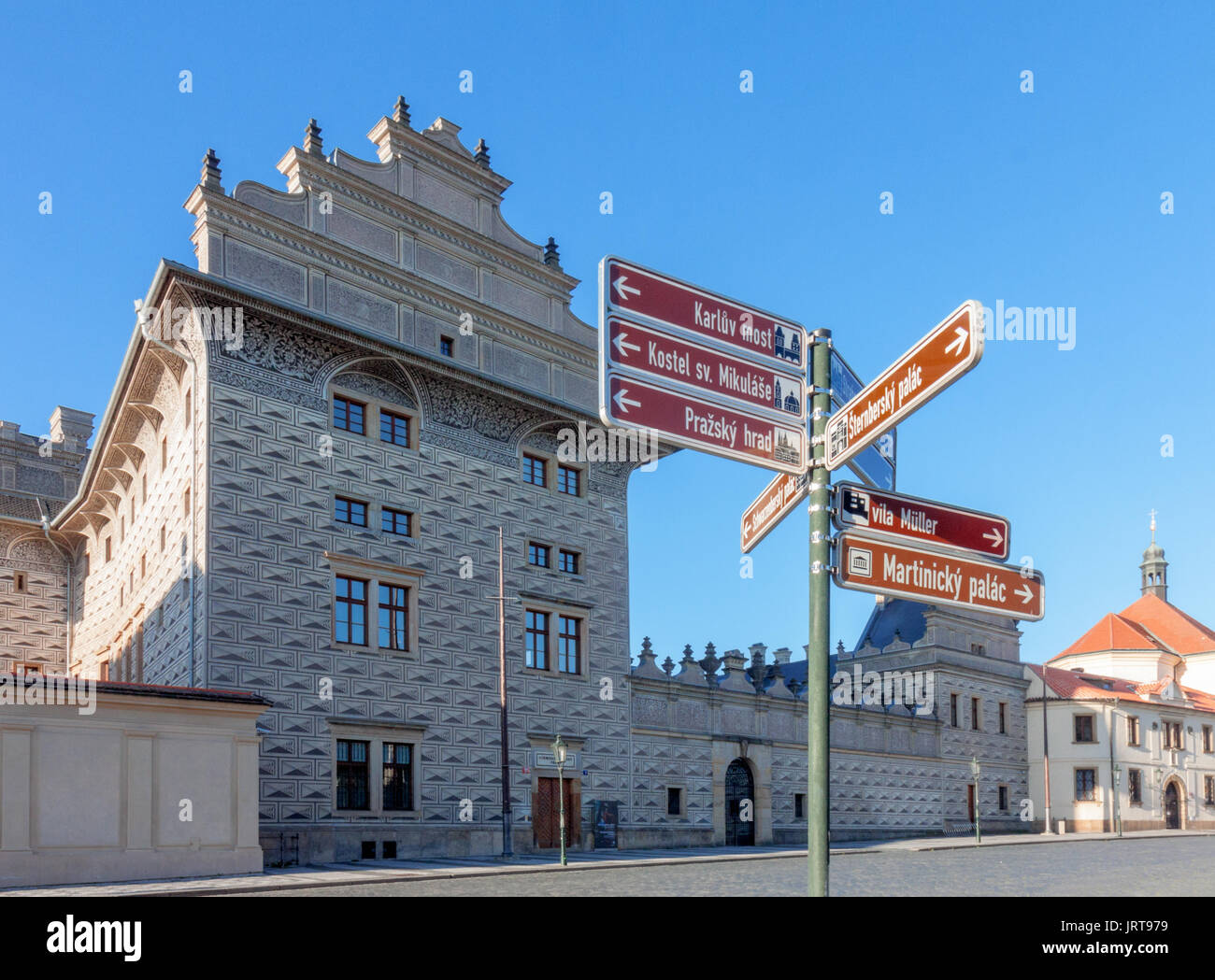 Prague - June 30: Traffic Information signs on Hradcany square with Schwarzenberg Palace on background early after sunrise on June 30, 2017 at Prague, Stock Photo