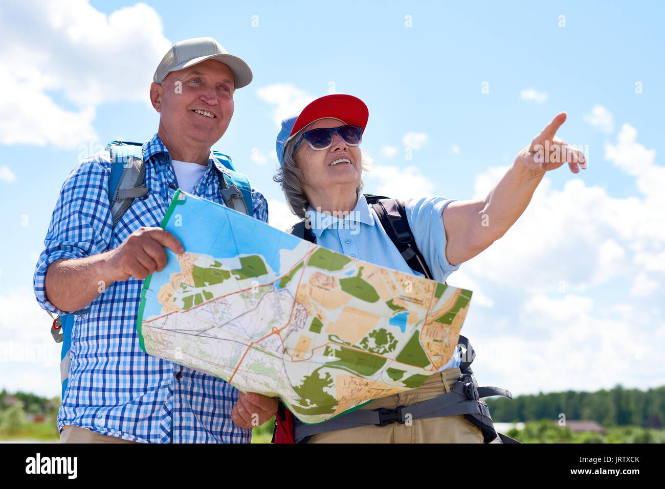 Happy Senior Couple Hiking Together Stock Photo