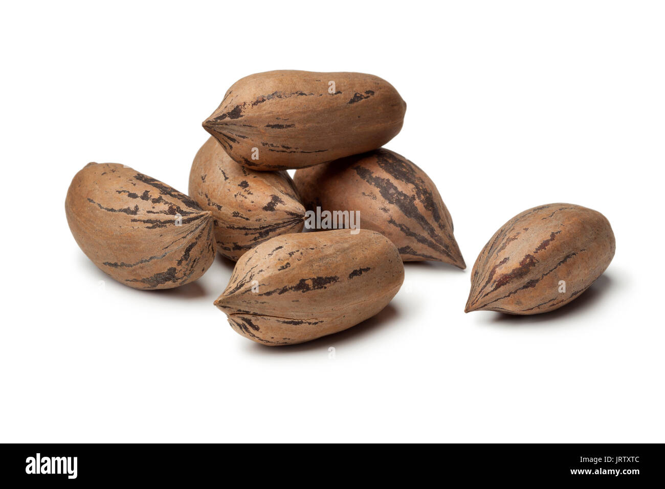 Organic unshelled pecan nuts on white background Stock Photo
