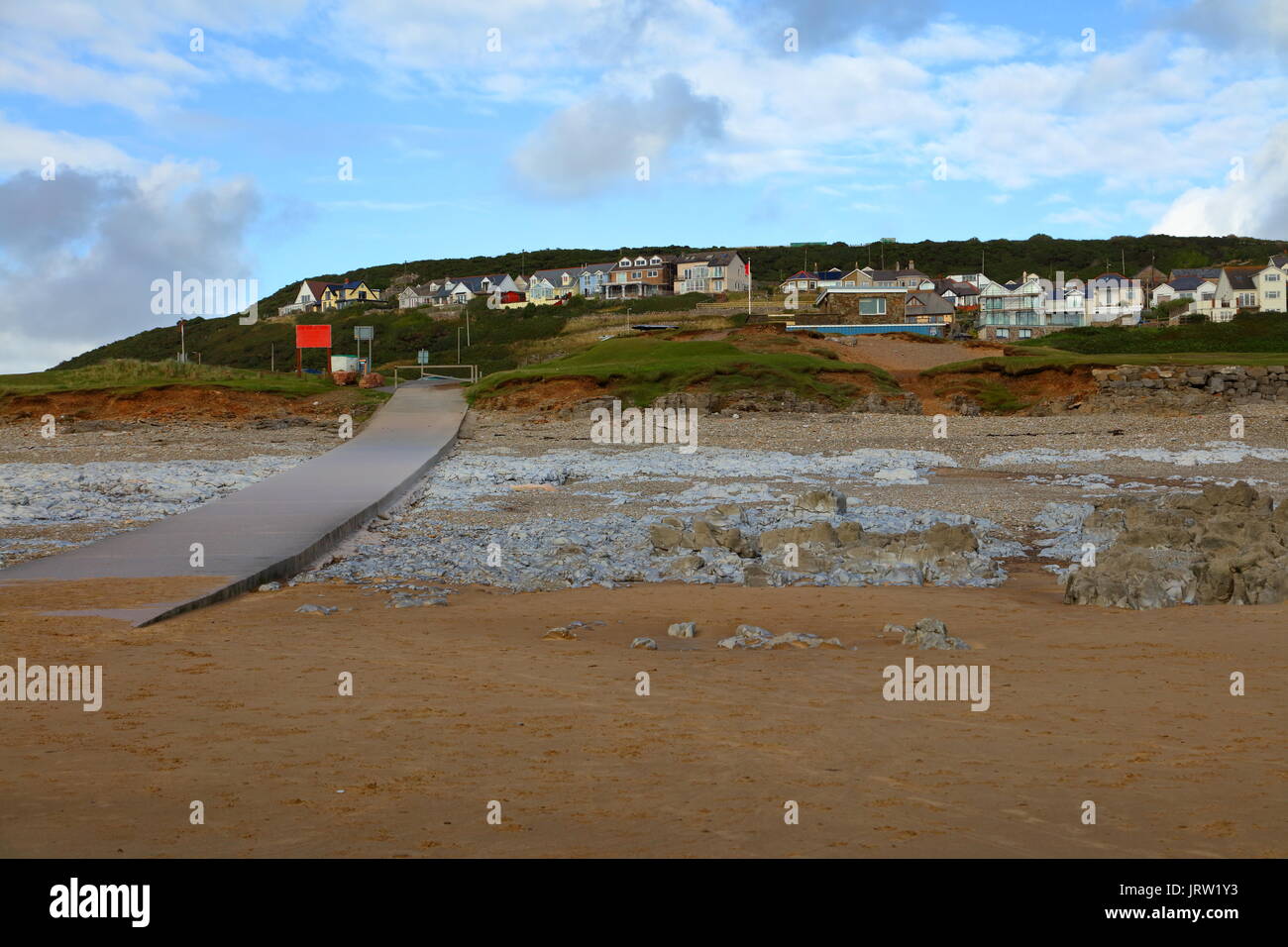 The beach at Ogmore with its lifeguards lookout shelter and boat