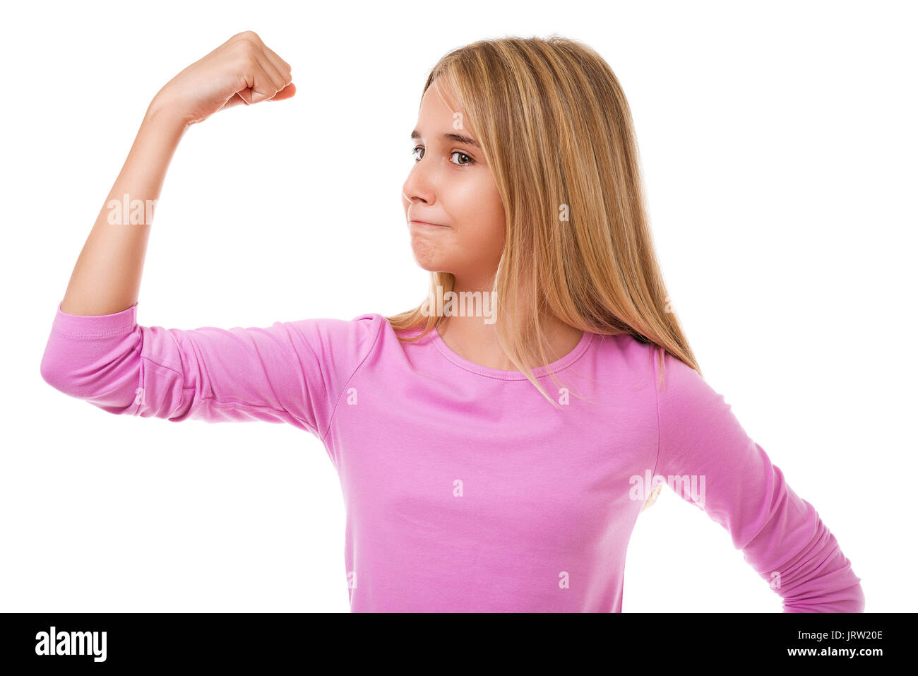 Girl power concept -  young teen girl showing her muscular arm for feminine and independent strength,studio shot Stock Photo