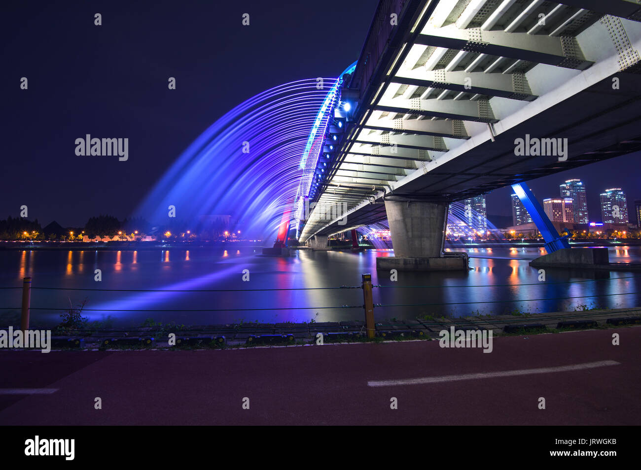 Rainbow fountain show at Expo Bridge in South Korea. Stock Photo