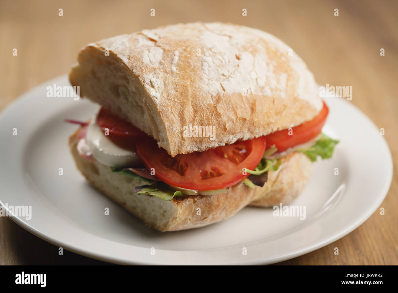 ciabatta sandwich with speck, mozzarella and vegetables Stock Photo Alamy