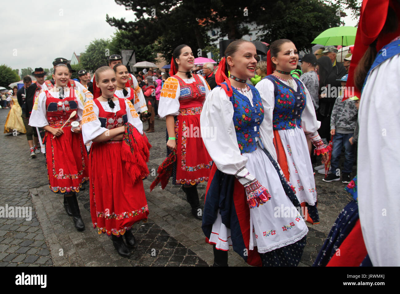 Folklore ensemble during a parade at the European Folk and Crafts Festival, Kezmarok, Slovakia. Stock Photo