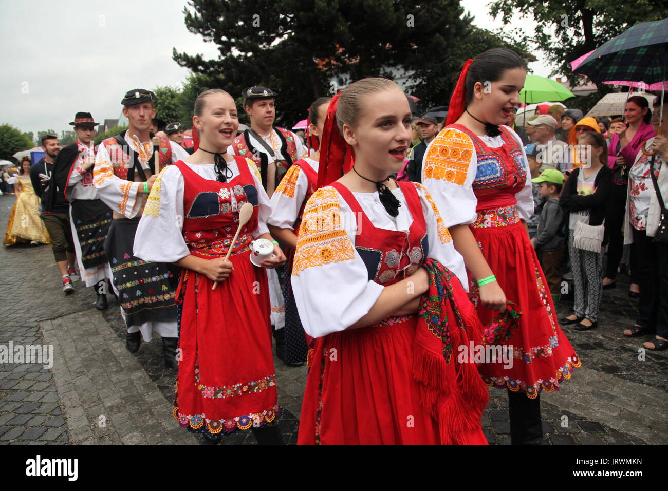 Folklore ensemble during a parade at the European Folk and Crafts Festival, Kezmarok, Slovakia. Stock Photo