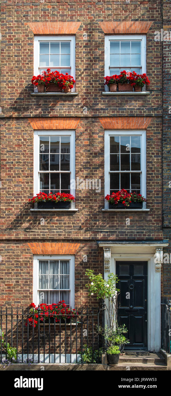 A Row of Brick Buildings with Black Doors on a Street in London Stock Image  - Image of architecture, english: 189002149