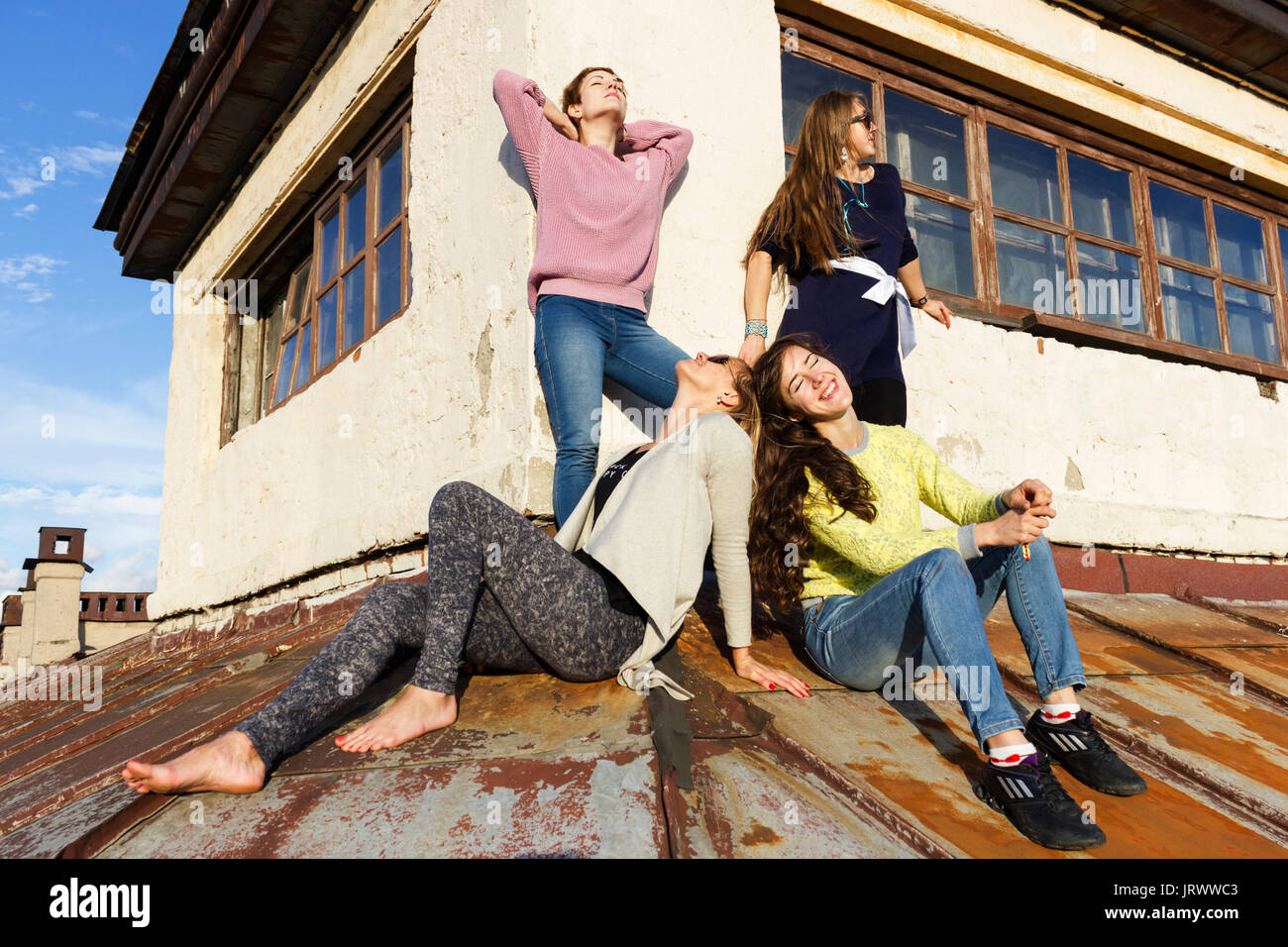 Brave girls walking on the roof of SaintPetersburg Stock Photo