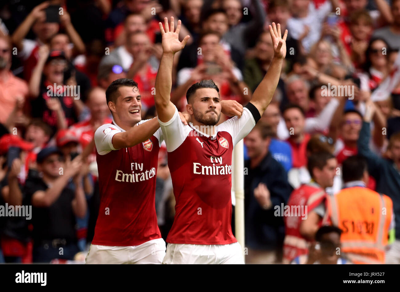 Arsenal's Sead Kolasinac (right) celebrates scoring his side's first goal of the game with Granit Xhaka during the Community Shield at Wembley, London. Stock Photo