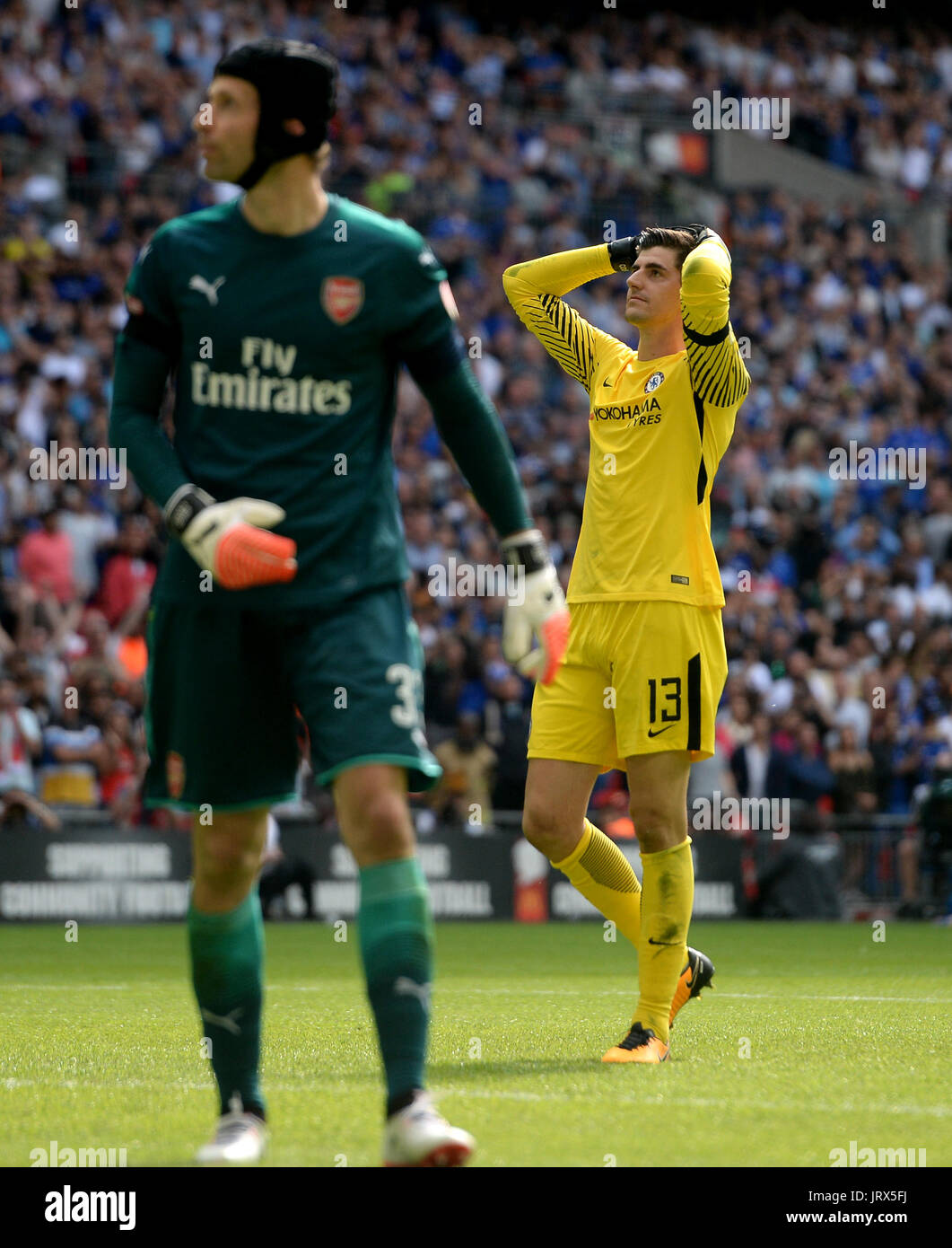 Chelsea's goalkeeper Thibaut Courtois reacts after he misses a penalty in the shoot out during the Community Shield at Wembley, London. Stock Photo