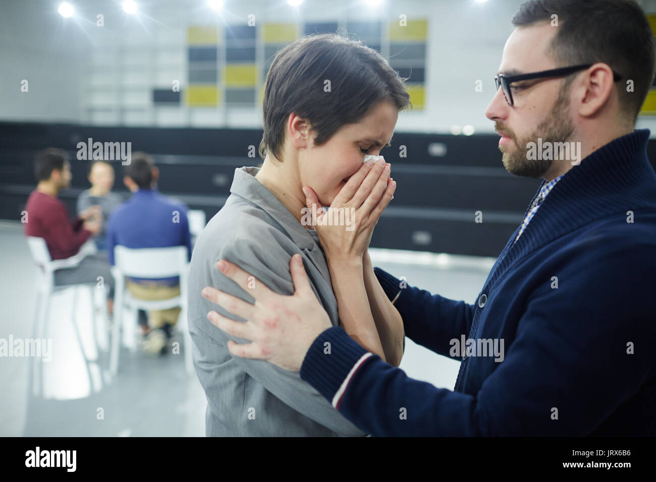 Comforting crying colleague Stock Photo