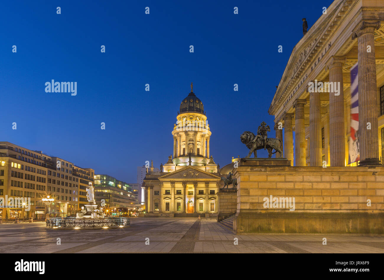 Berlin - The Deutscher Dom church and Gendarmenmarkt square and the Concert house at dusk. Stock Photo