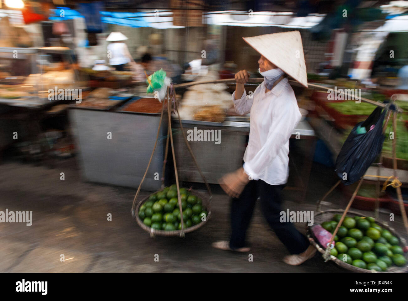 Limes seller near Hanoi Market Old Quarter. Hanoi, North Vietnam, Vietnam, Southeast Asia, Asia Stock Photo