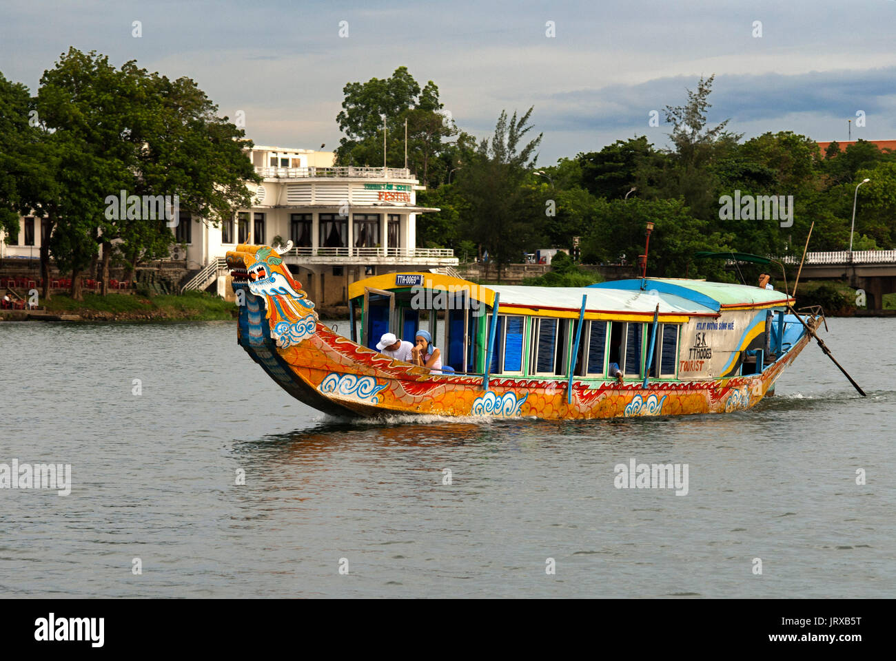 Dragon boat cuise on the river Huong (Perfume River). Vietnam. Dragon head and excursion boat, Song Huong or Huong Giang or Perfume River, near Hue, N Stock Photo