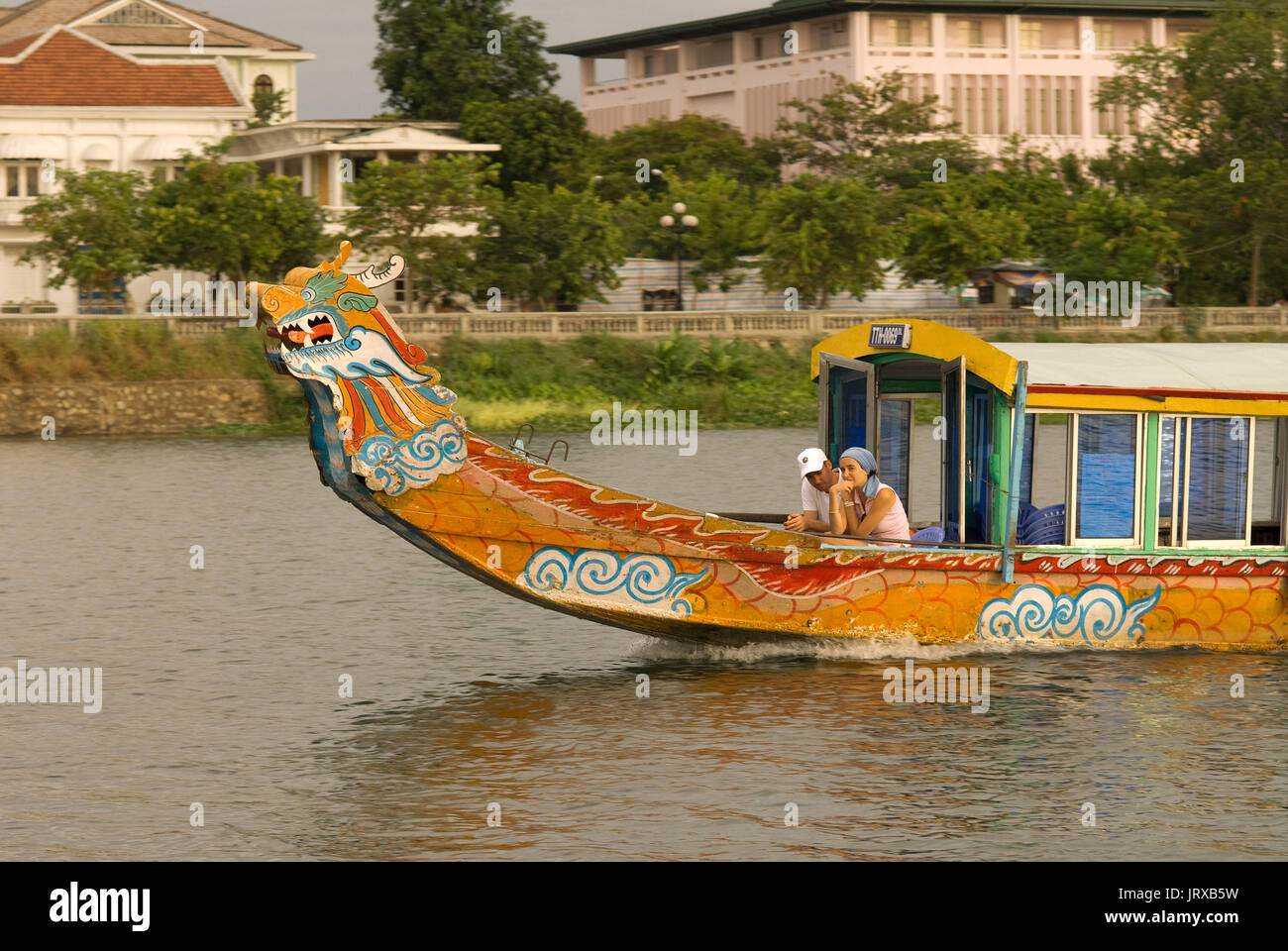 Dragon boat cuise on the river Huong (Perfume River). Vietnam. Dragon head and excursion boat, Song Huong or Huong Giang or Perfume River, near Hue, N Stock Photo