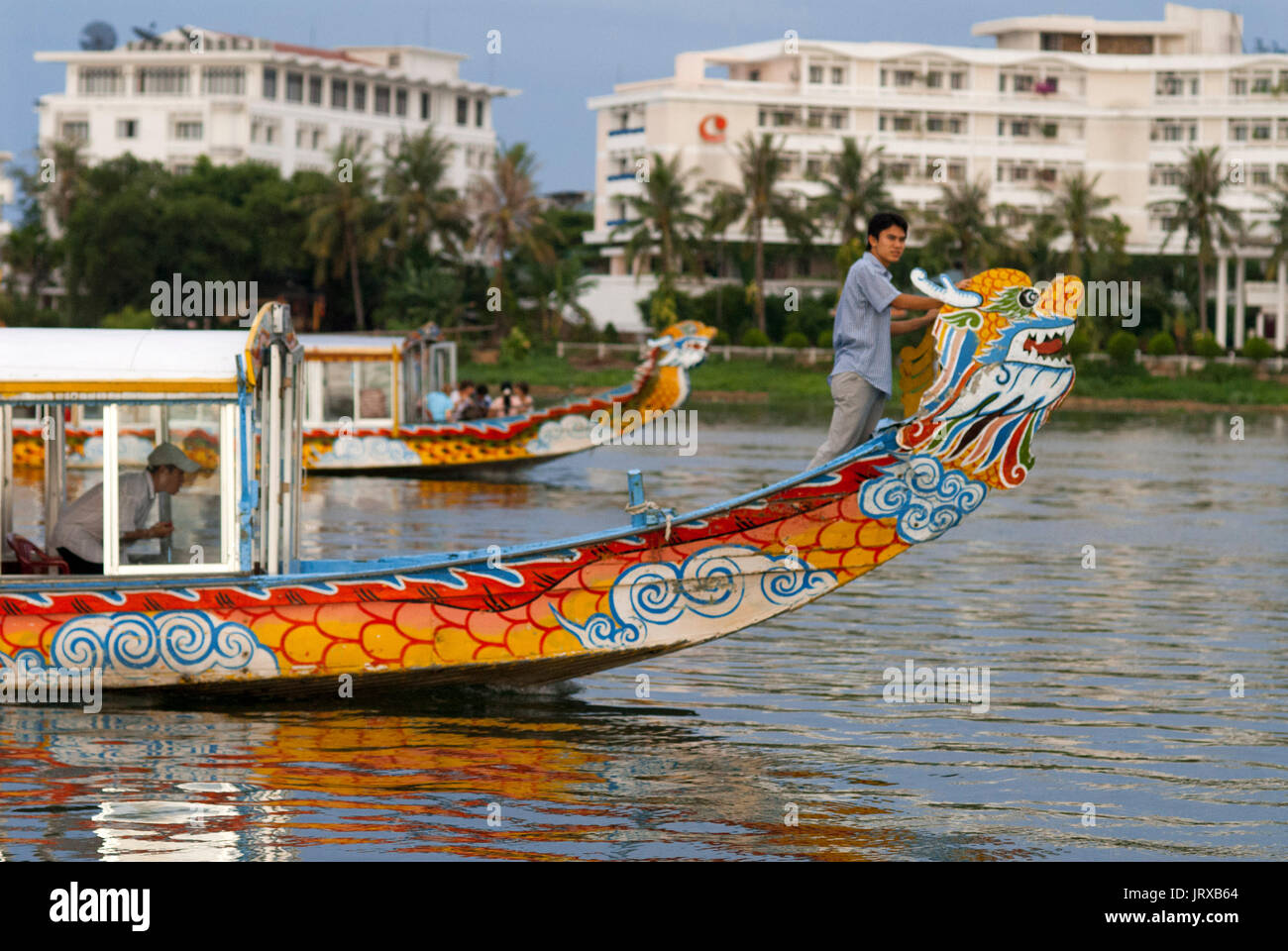Dragon boat cuise on the river Huong (Perfume River). Vietnam. Dragon head and excursion boat, Song Huong or Huong Giang or Perfume River, near Hue, N Stock Photo