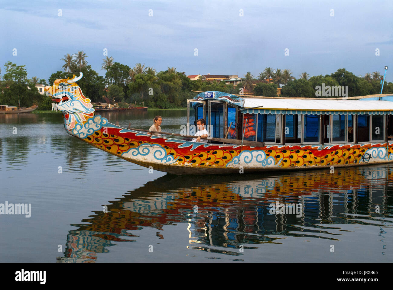 Dragon boat cuise on the river Huong (Perfume River). Vietnam. Dragon head and excursion boat, Song Huong or Huong Giang or Perfume River, near Hue, N Stock Photo