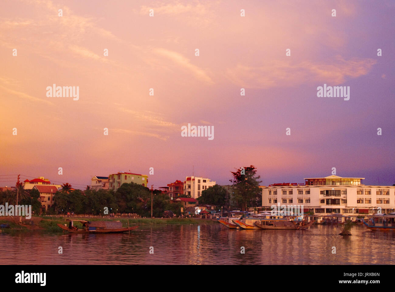 Dragon boat cuises at sunset on the river Huong (Perfume River). Vietnam. Dragon head and excursion boat, Song Huong or Huong Giang or Perfume River,  Stock Photo