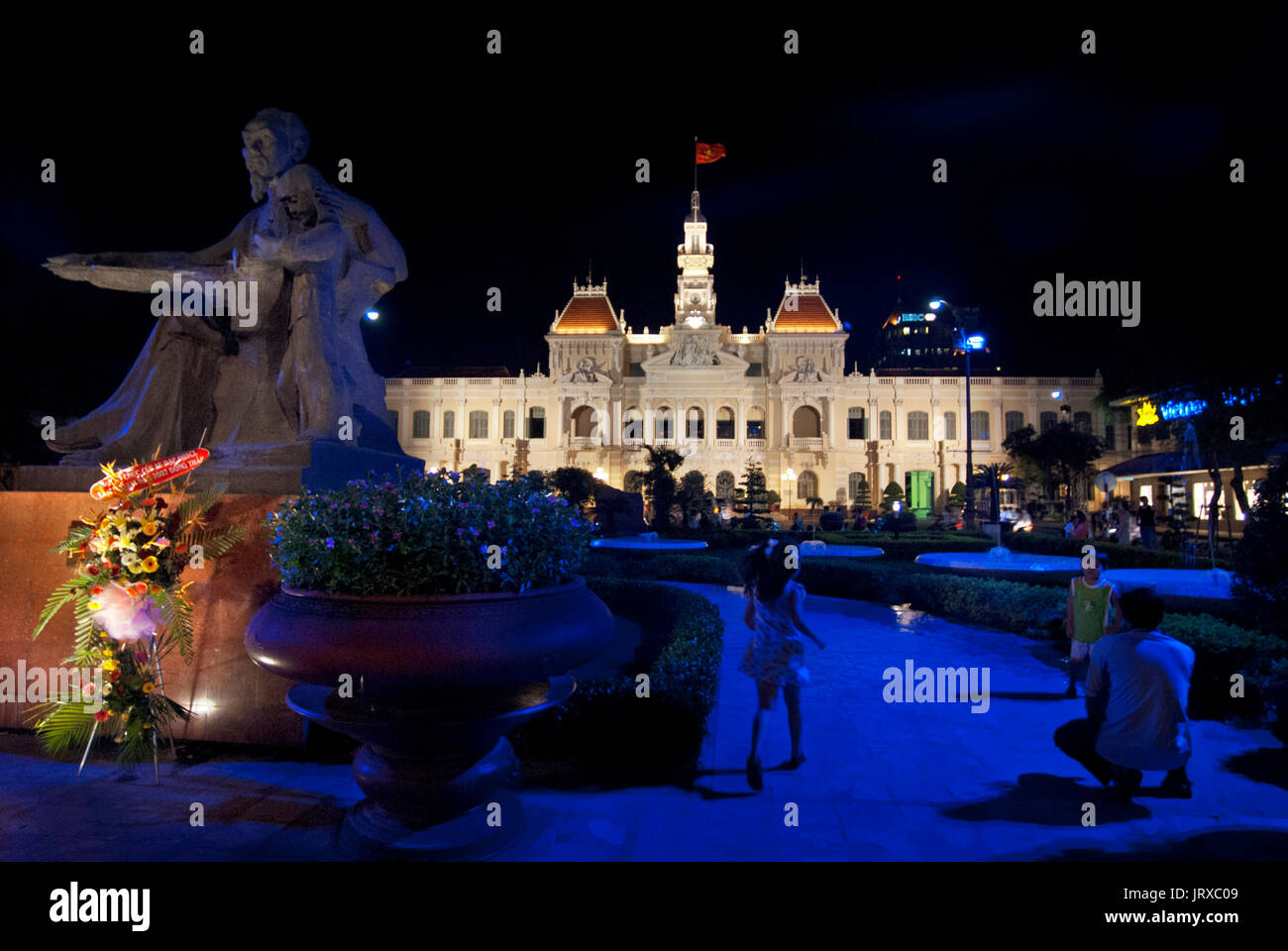 Statue of Ho Chi Minh, in Front of Hotel de Ville , Ho Chi Minh City , Vietnam. HSBC bank. Ho Chi Minh Statue, People's Committee Building Saigon Viet Stock Photo