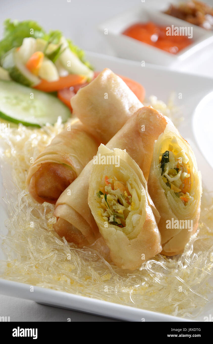 Indonesian Spring rolls served with garnish and sambal, chili paste