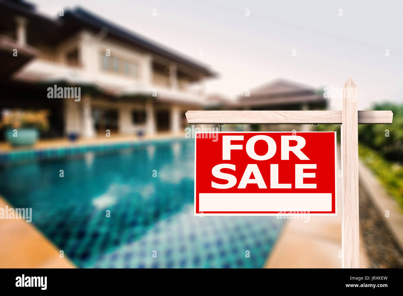 for sale sign at luxury house with pool background Stock Photo - Alamy