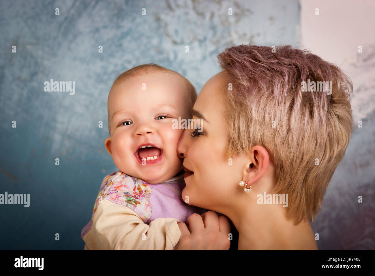 Attractive young mother playing with her daughter Stock Photo