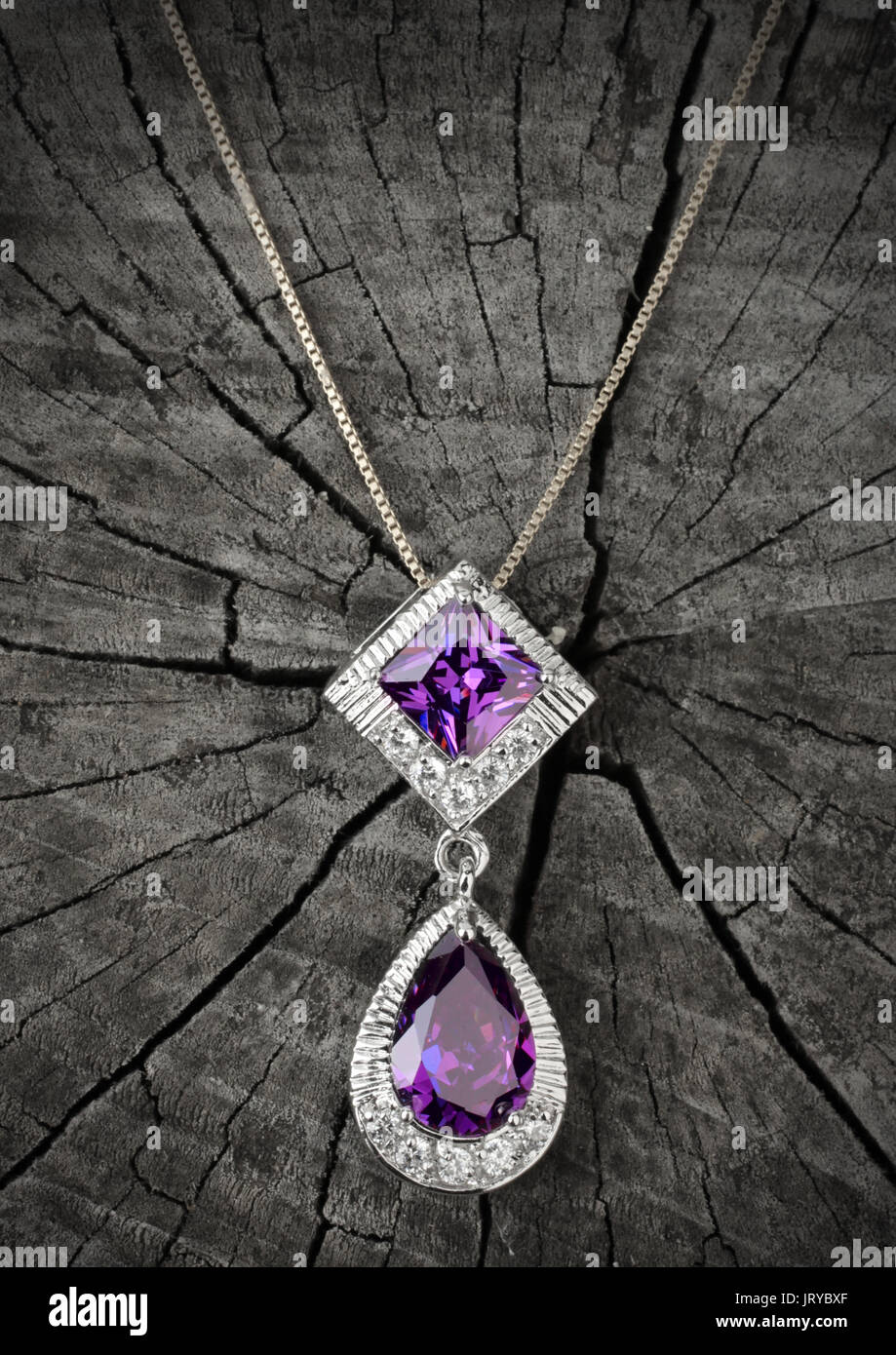 Jewelry pendant on black wood background Stock Photo Alamy