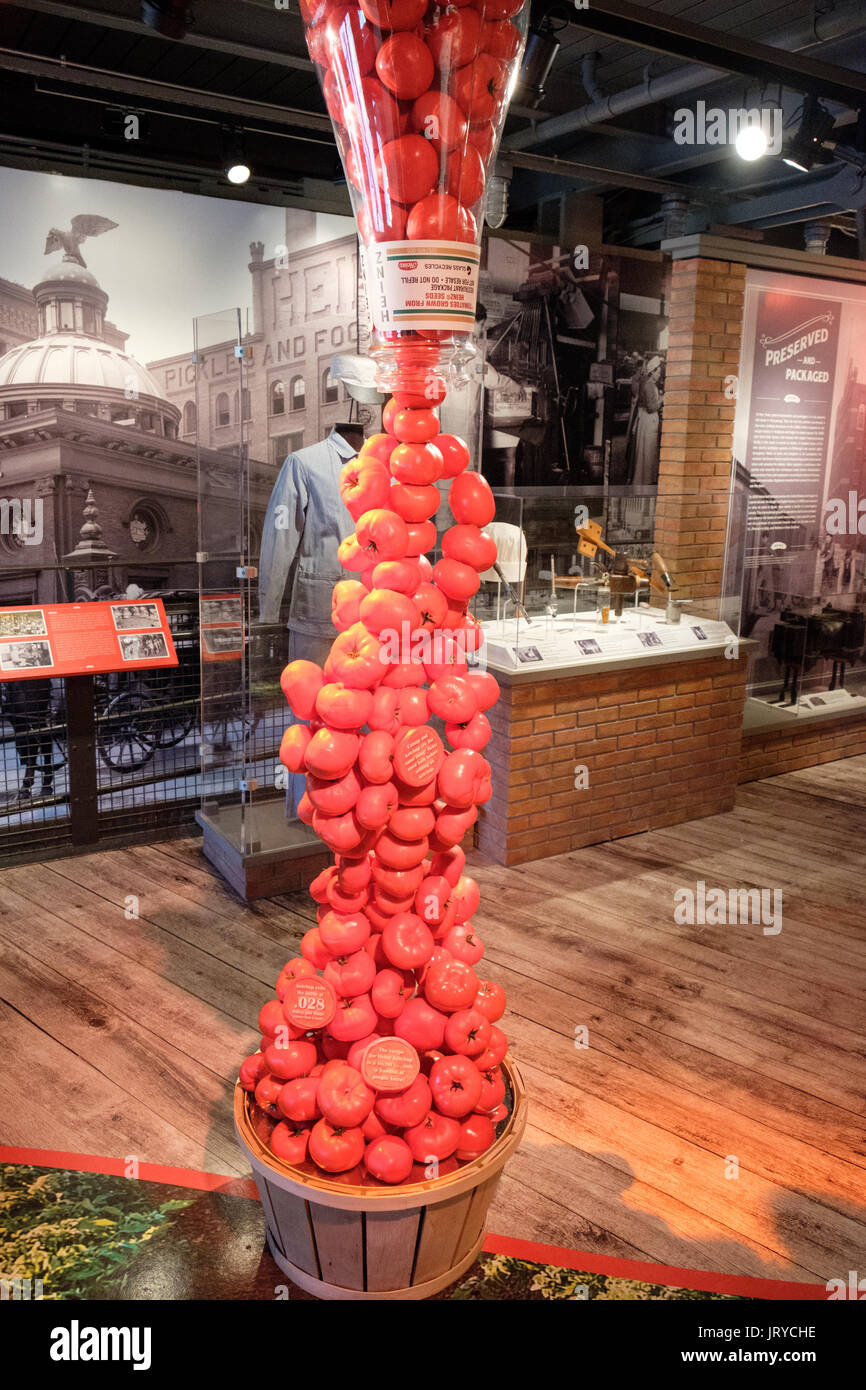 Large upside down Heinz tomato ketchup bottle with tomatoes falling out